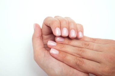 Woman french manicure on trendy pink.