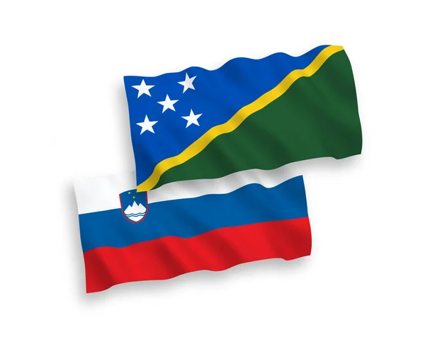 Bandiere della Slovenia e delle Isole Salomone su sfondo bianco — Vettoriale Stock