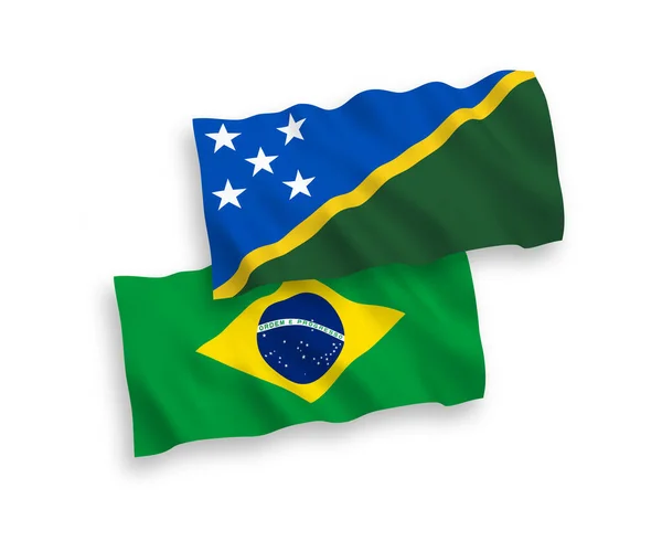 Flags of Brazil and Solomon Islands on a white background — Vetor de Stock