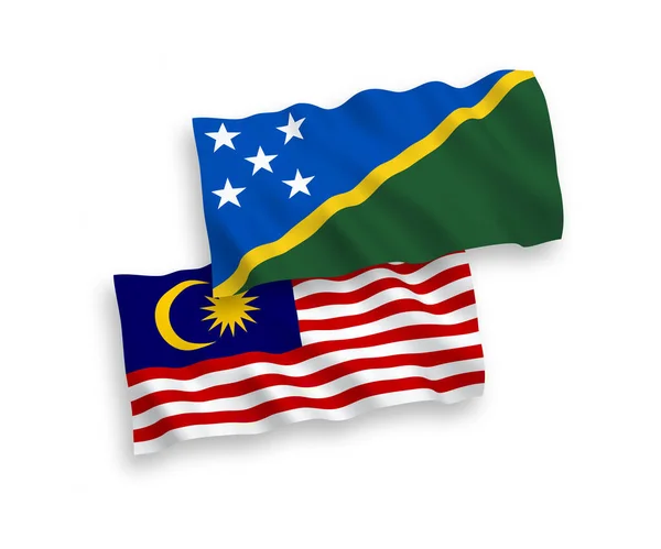 Bendera Kepulauan Solomon dan Malaysia pada latar belakang putih - Stok Vektor