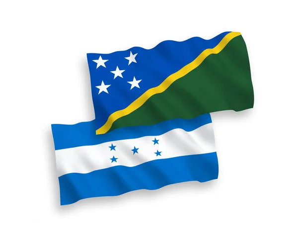 所罗门群岛和洪都拉斯的国家病媒织物波条旗在白色背景下隔离 1比2的比例 — 图库矢量图片
