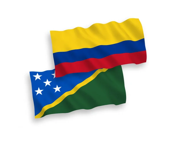 Flaggen der Salomonen und Kolumbiens auf weißem Hintergrund — Stockvektor