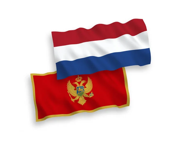 Vlajky Černé Hory a Nizozemska na bílém pozadí — Stockový vektor