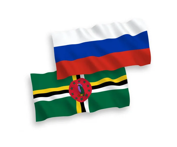 Flagi Dominiki i Rosji na białym tle — Wektor stockowy