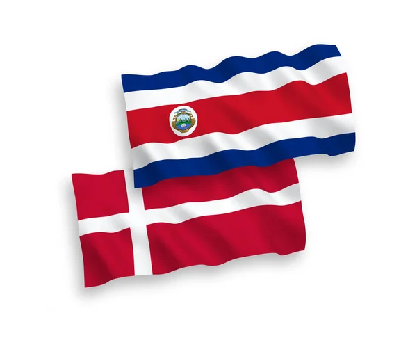 Vlajky Dánska a Kostarické republiky na bílém pozadí — Stockový vektor