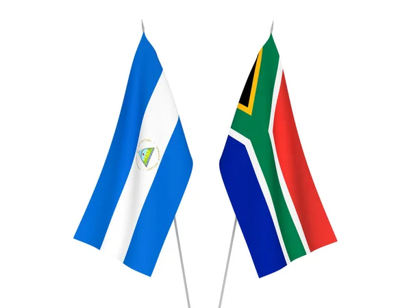 Nationella Tyg Flaggor Republiken Sydafrika Och Nicaragua Isolerad Vit Bakgrund — Stockfoto