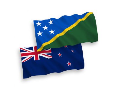 Beyaz zemin üzerinde Yeni Zelanda ve Solomon Adaları 'nın ulusal taşıyıcı kumaş bayrakları izole edilmiştir. 1 'e 2 oranında.