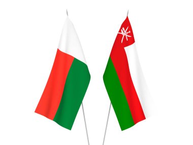 National fabric flags of Madagascar and Sultanate of Oman isolated on white background. 3d rendering illustration.