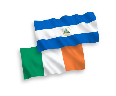 National vector fabric wave flags of Ireland and Nicaragua isolated on white background. 1 to 2 proportion.