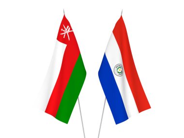 National fabric flags of Sultanate of Oman and Paraguay isolated on white background. 3d rendering illustration.