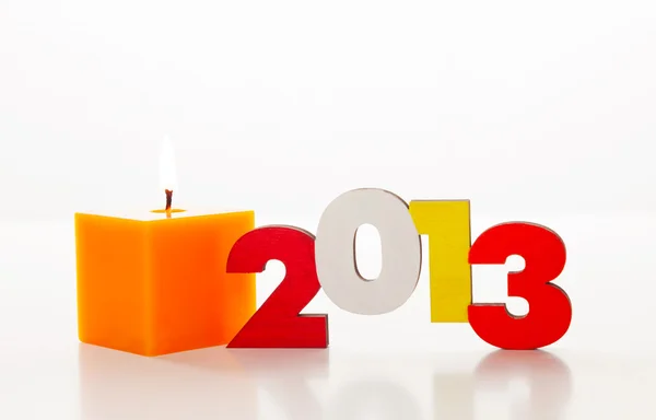 Número de año 2013 de madera con una vela encendida —  Fotos de Stock