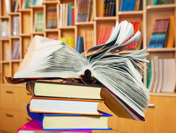 Open book on a stack of books — Stock Photo, Image