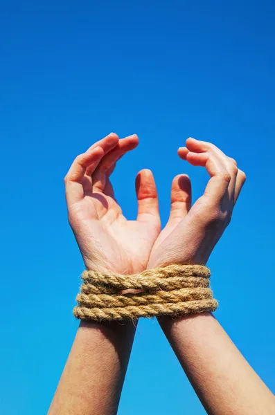 Hands tied up with rope — Stock Photo, Image