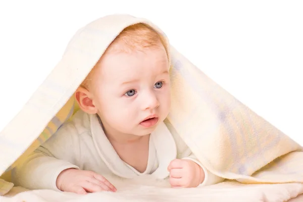 Portrait of a beautiful baby under a blanket — Stock Photo, Image