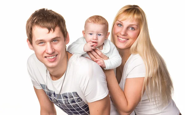 Portrait of a young happy family: mother, father and baby smiling — Stock Photo, Image