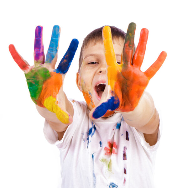 Little boy with hands painted in colorful paints ready for hand