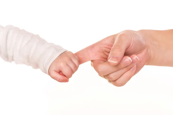 Baby holds mother's finger, trust family help concept — Stock Photo, Image