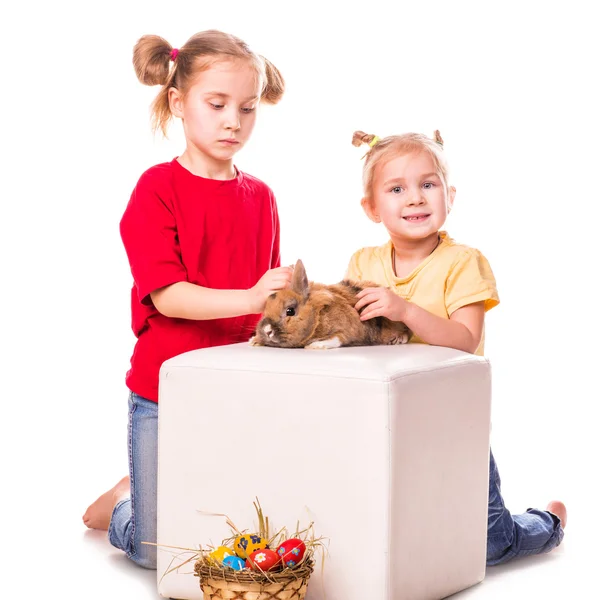 Two happy kids with easter bunny and eggs. Happy Easter Stock Photo