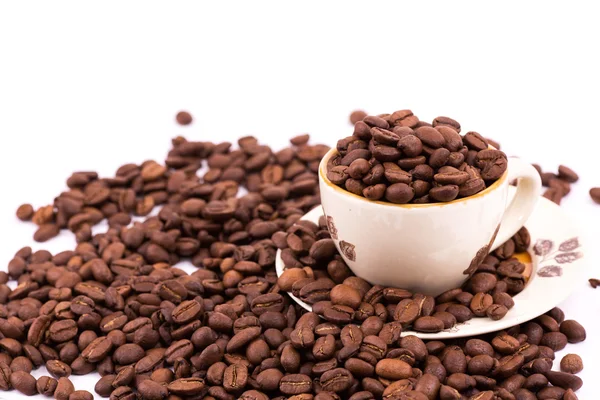 Granos de café y taza de fondo de café — Foto de Stock