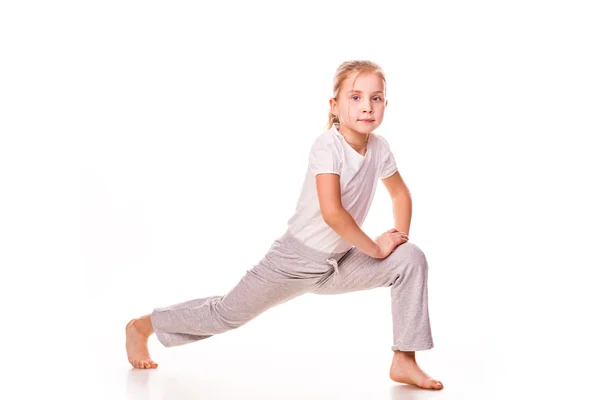 Beautiful girl gymnast exercising, stretching — Stock Photo, Image