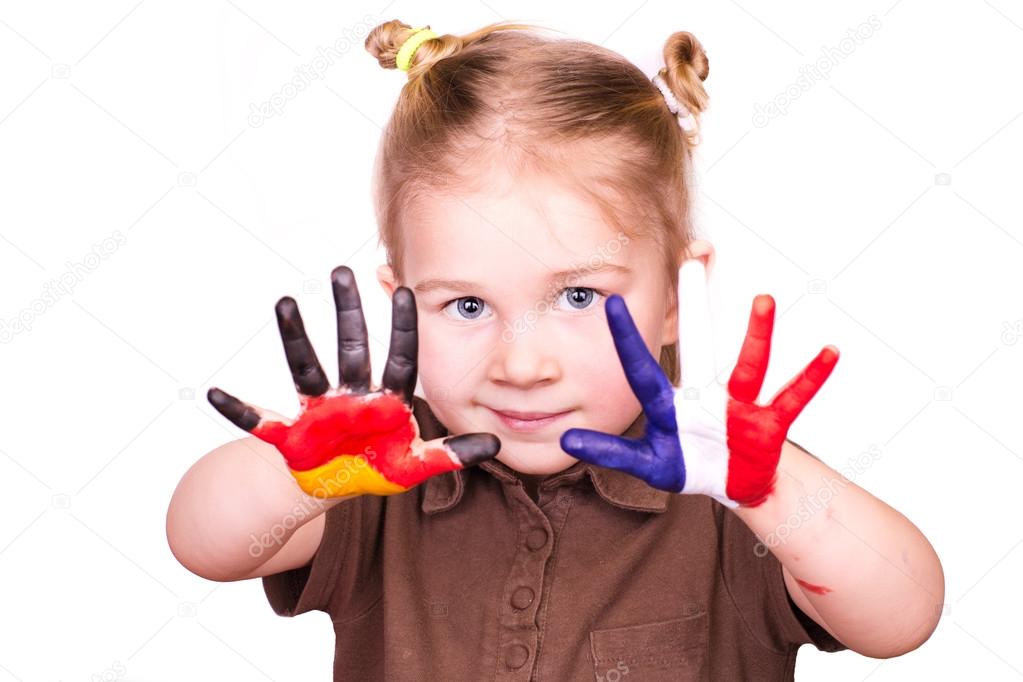 Beautiful girl with hands painted as German and French flags