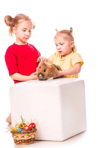 Two happy kids with easter bunny and eggs. Happy Easter Stock Image