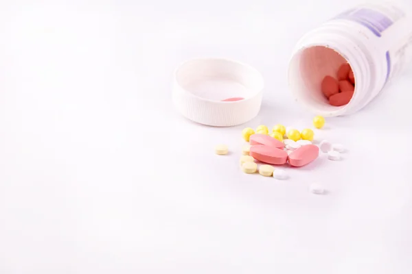 Medicine and pills scattered around — Stock Photo, Image