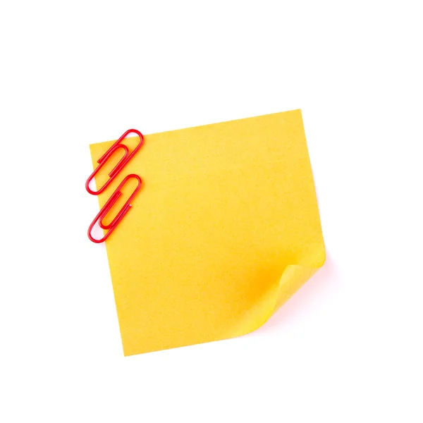 Orange sticky paper note with red clips — Zdjęcie stockowe