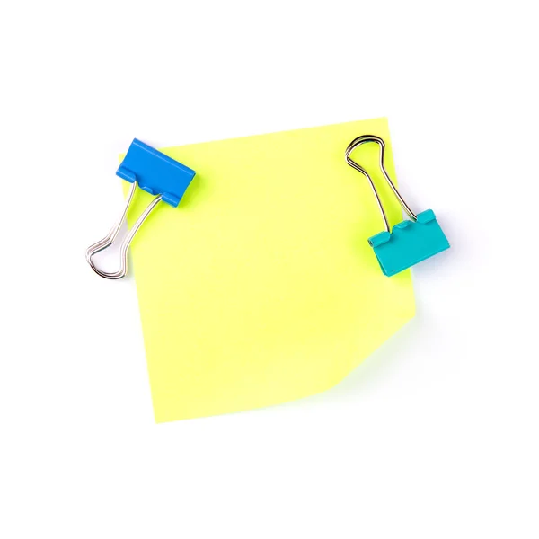 Neon geel papier opmerking met blauwe clips — Stockfoto