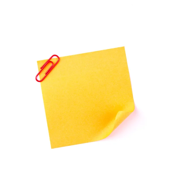 Nota de papel pegajoso laranja com um clipe vermelho — Fotografia de Stock