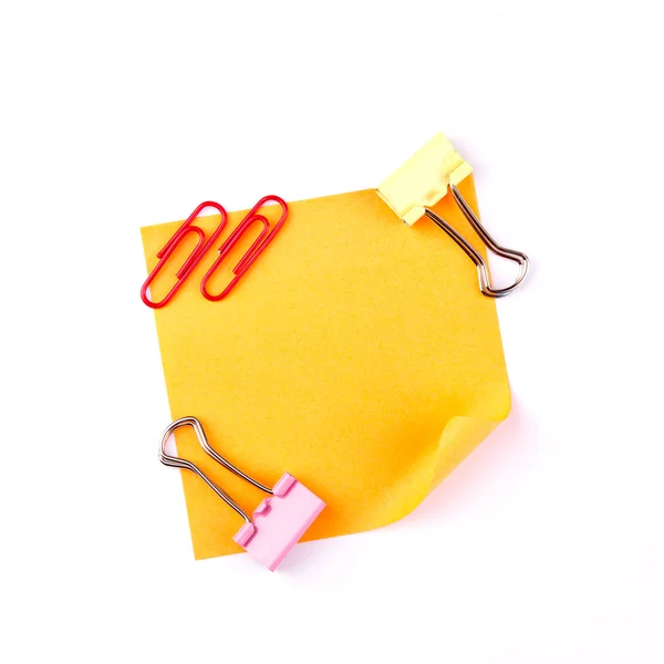 Orange sticky paper note with red clips — Stock Photo, Image