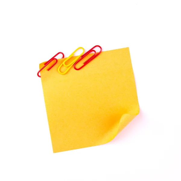 Orange sticky paper note with red clips — Zdjęcie stockowe