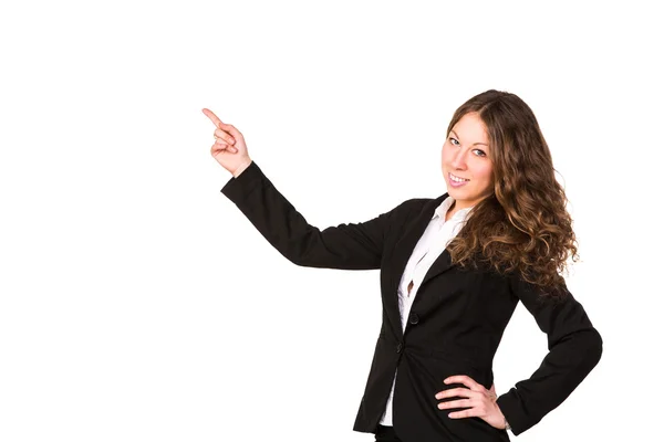 Beautiful confident businesswoman pointing her finger at copyspace — Stock Photo, Image