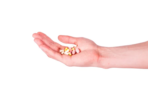 Male hand holding a handful of medical pills — Stock Photo, Image