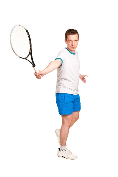 Deportivo joven jugando al tenis —  Fotos de Stock