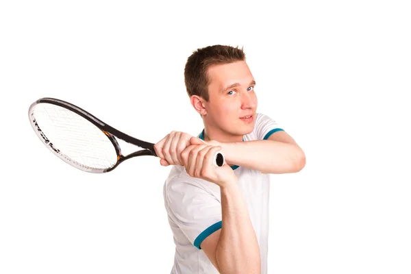 Sportive young man playing tennis — Stock Photo, Image