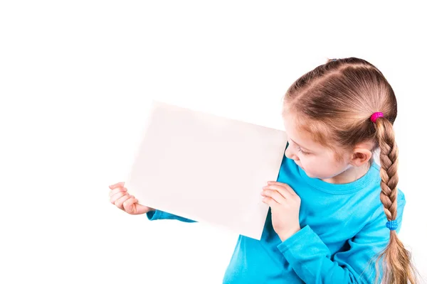 Smiling little girl holding white card for you sample text — Stock Photo, Image