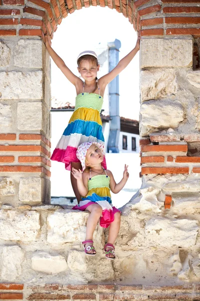 Beautiful little girls in ancient ruins of the Nesebar — Stock Photo, Image