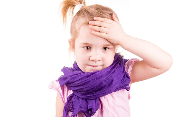 Sick little girl with chickenpox measuring temperature and checking her forhead — Stock Photo, Image