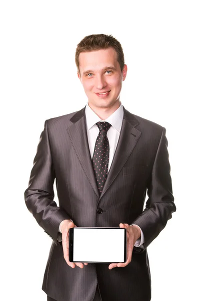 Young businessman showing a tablet pc comuter with blank screen for your sample text