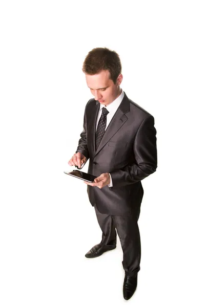 Young businessman working on a tablet pc comuter Stock Image