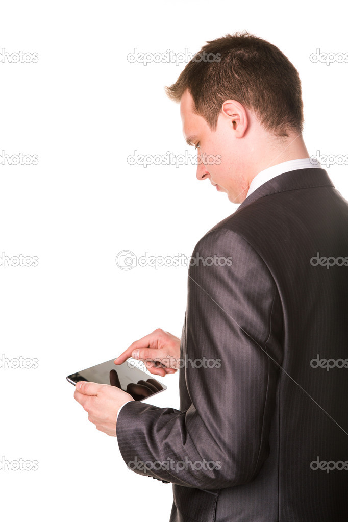 Young businessman working on a tablet pc comuter