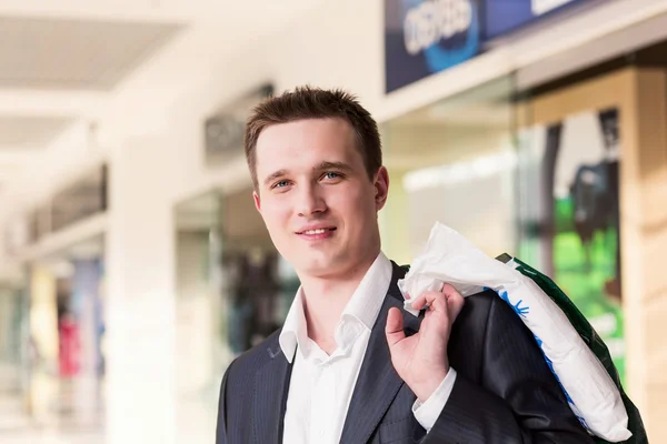 Attractive young man shopping at the store — Stock Photo, Image