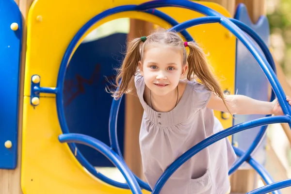 Beautiful little girl on outdoor playground — Stock Photo, Image