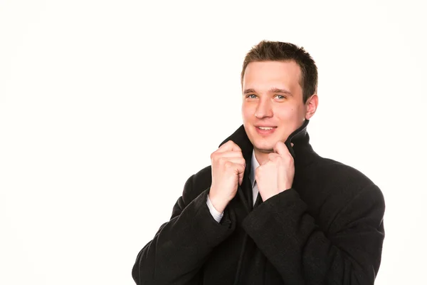 Handsome young businessman in a coat isolated — Stock Photo, Image