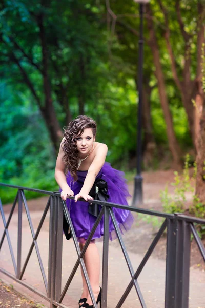 Beautiful young girl in a beautiful dress outdoor — Stock Photo, Image