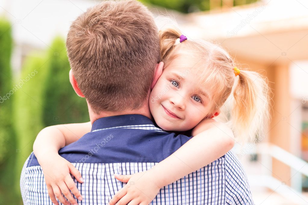 Happy father and daughter playing in the park