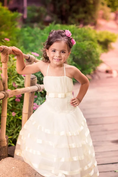 Charming little girl in a beautiful dress outdoor — Stock Photo, Image