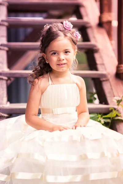 Charming little girl in a beautiful dress outdoor — Stock Photo, Image