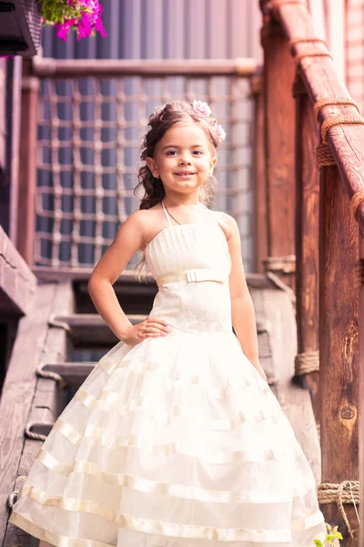 Charming little girl in a beautiful dress outdoor — Stock Photo, Image